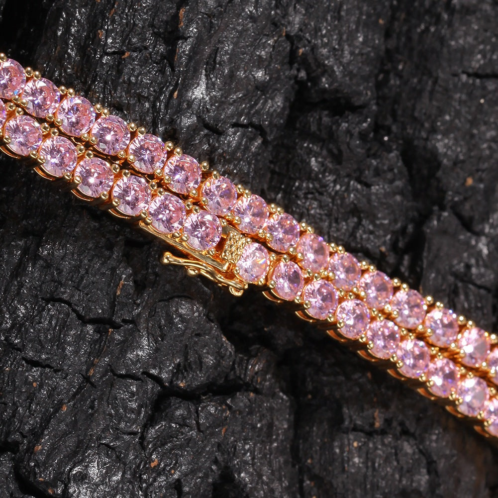 Pink gemstone bracelet on a dark textured surface