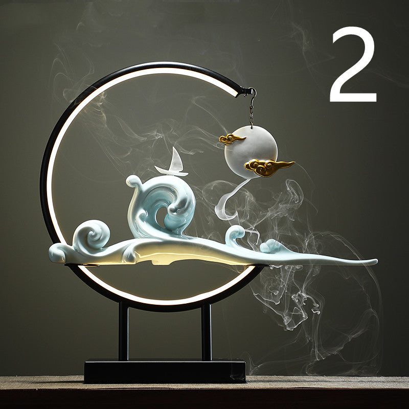 Decorative lamp with wave and cloud design on a dark background  incense burner