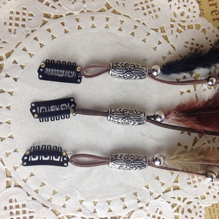 Three hair clips with decorative elements on a textured white background
