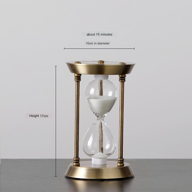 Gold hourglass with measurements on a gray background