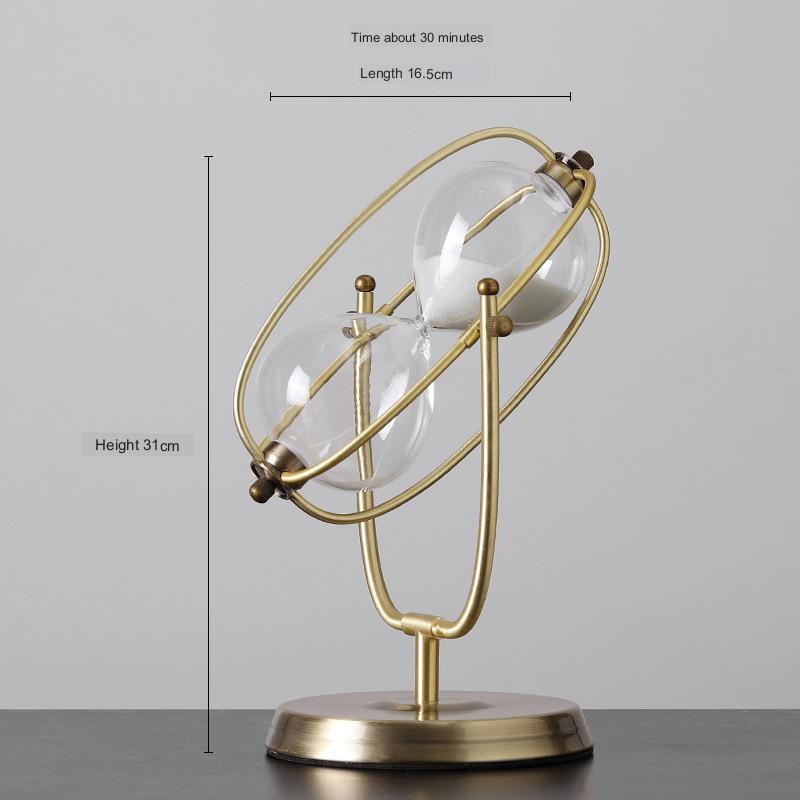 Gold hourglass with measurements on a gray background