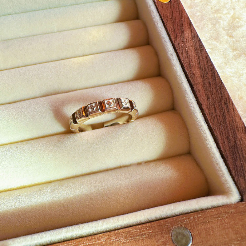 Gold ring with diamonds in a wooden jewelry box