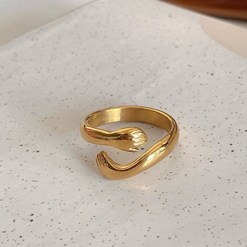 Gold ring on a textured white surface