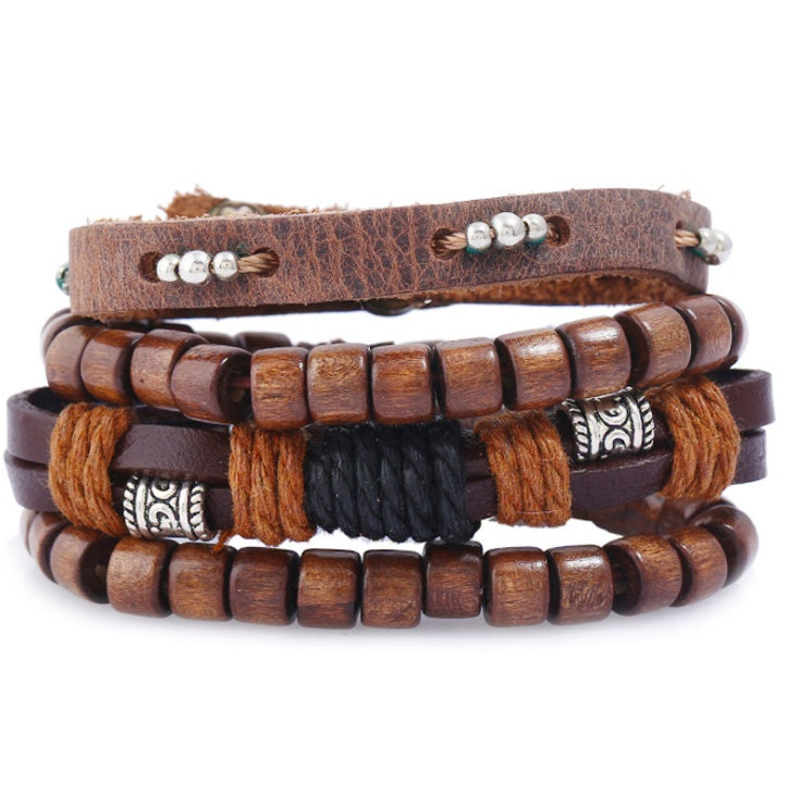 Stack of wooden and leather bracelets with beads on a white background