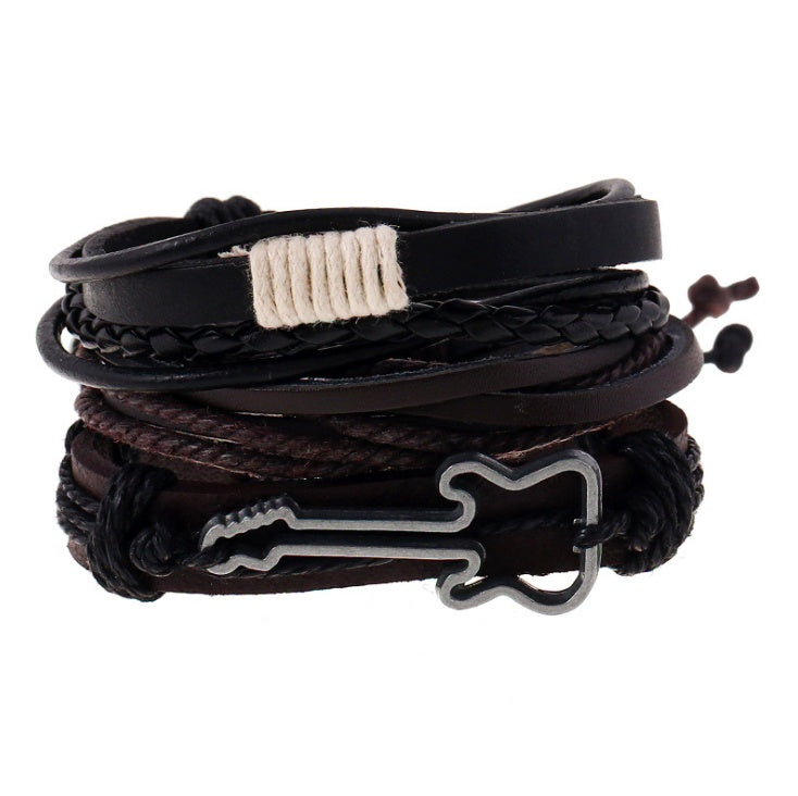 Stack of braided leather bracelets with metal dog bone charm on a white background