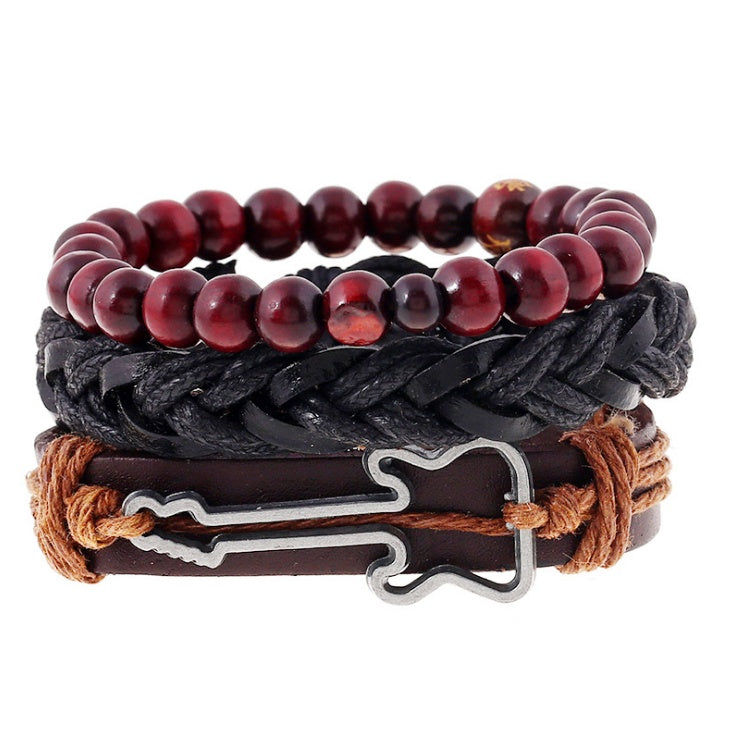 Stack of leather and beaded bracelets with a metal clasp on a white background