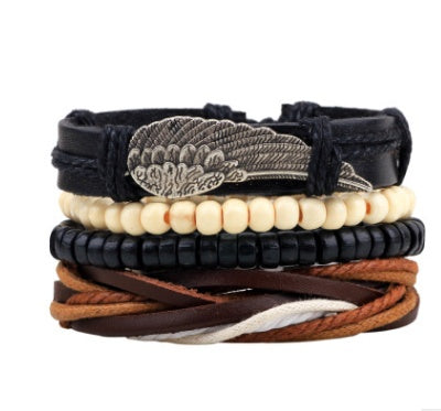 Stack of leather and beaded bracelets on a white background