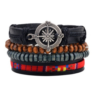 Stack of colorful bracelets with a central silver compass design on a white background