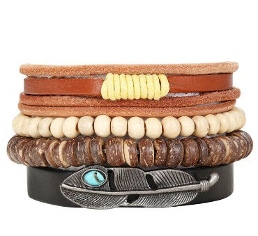 Stack of leather and beaded bracelets with feather and turquoise stone design on a white background