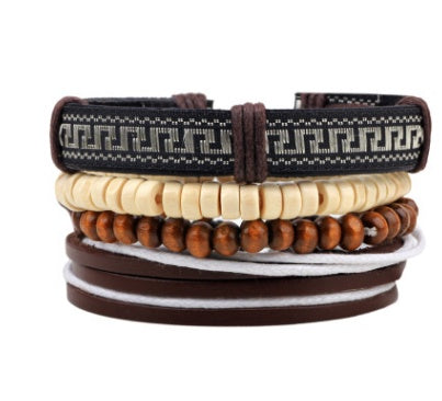 Stack of leather and beaded bracelets on a white background