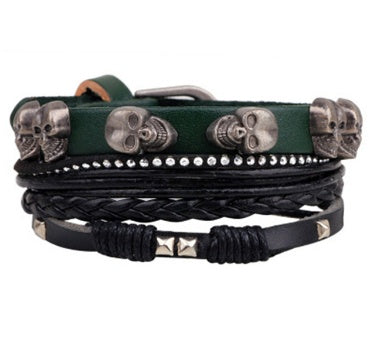 Multi-layered leather bracelet with skull designs on a white background