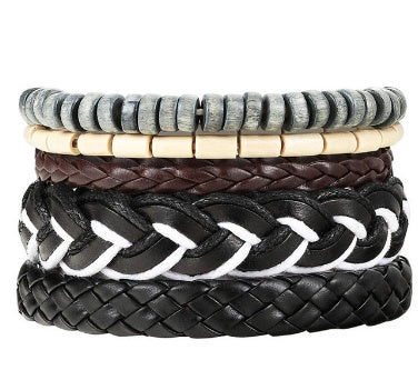 Set of four woven bracelets in different styles on a white background