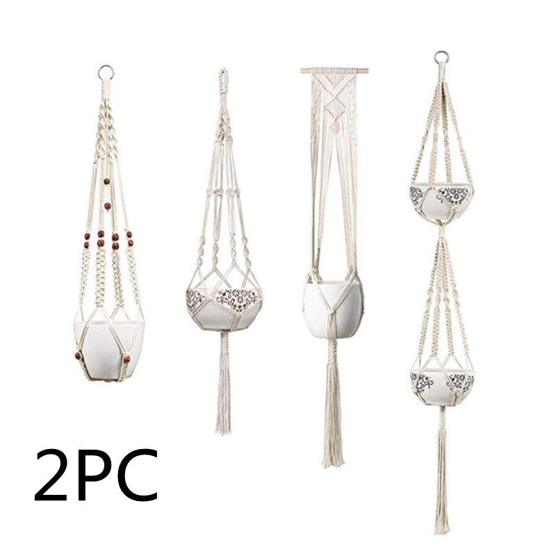 Set of four macrame plant hangers with decorative elements on a white background