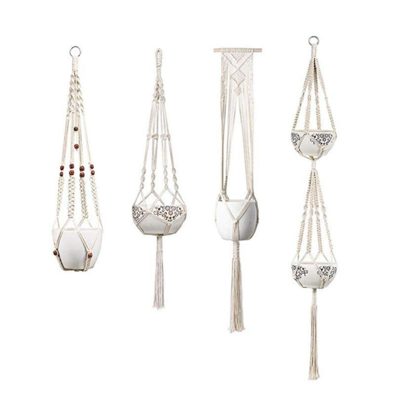 Set of four macrame plant hangers with decorative elements on a white background