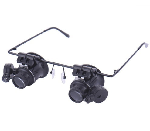 Pair of magnifying glasses with adjustable arms on a white background