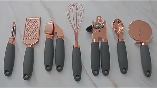 Elegant 7-piece stainless steel utensil set featuring a gleaming rose gold finish