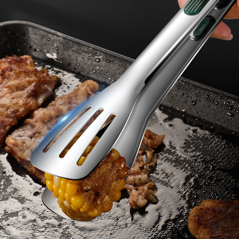 Metallic corn shuck removal tool being used on a grill with corn and meat.