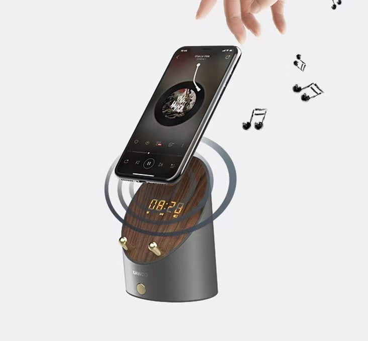 wireless speaker phone charger on white background