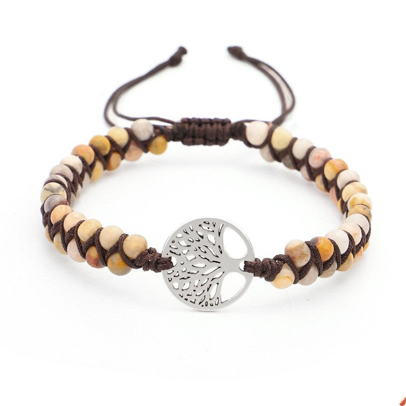 Bracelet with tree of life charm on a white background