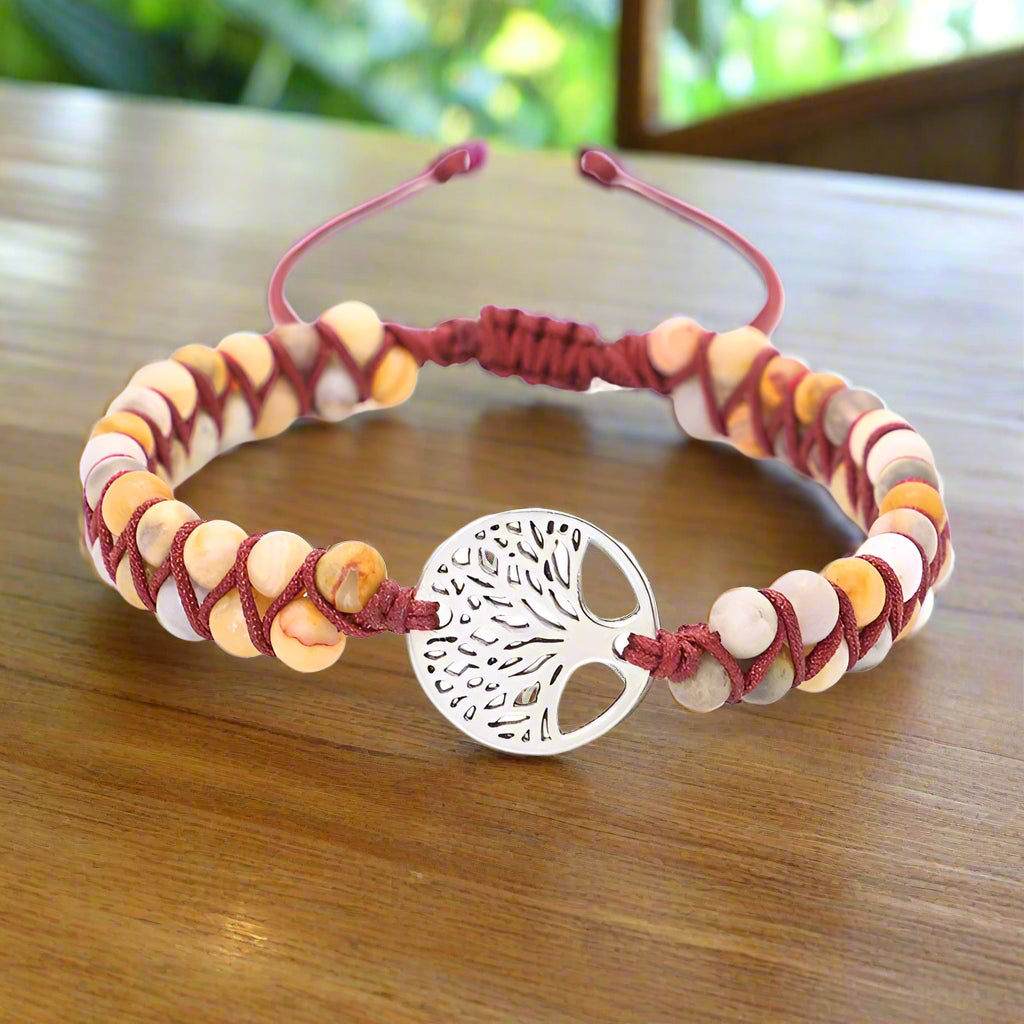 Bracelet with tree of life charm on a white background
